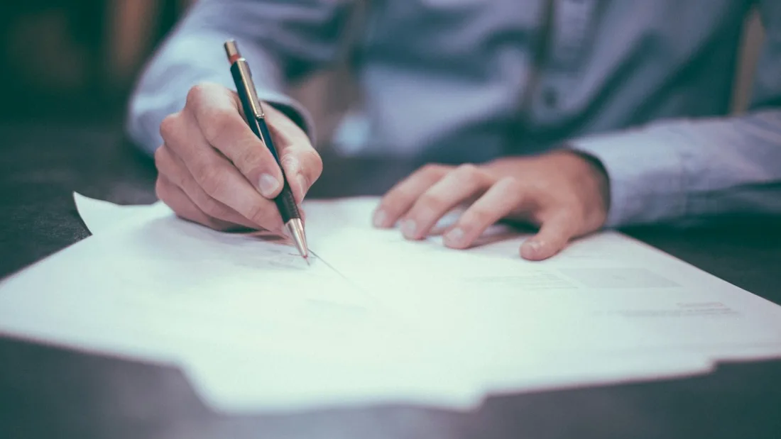 A vendor registration form being read through