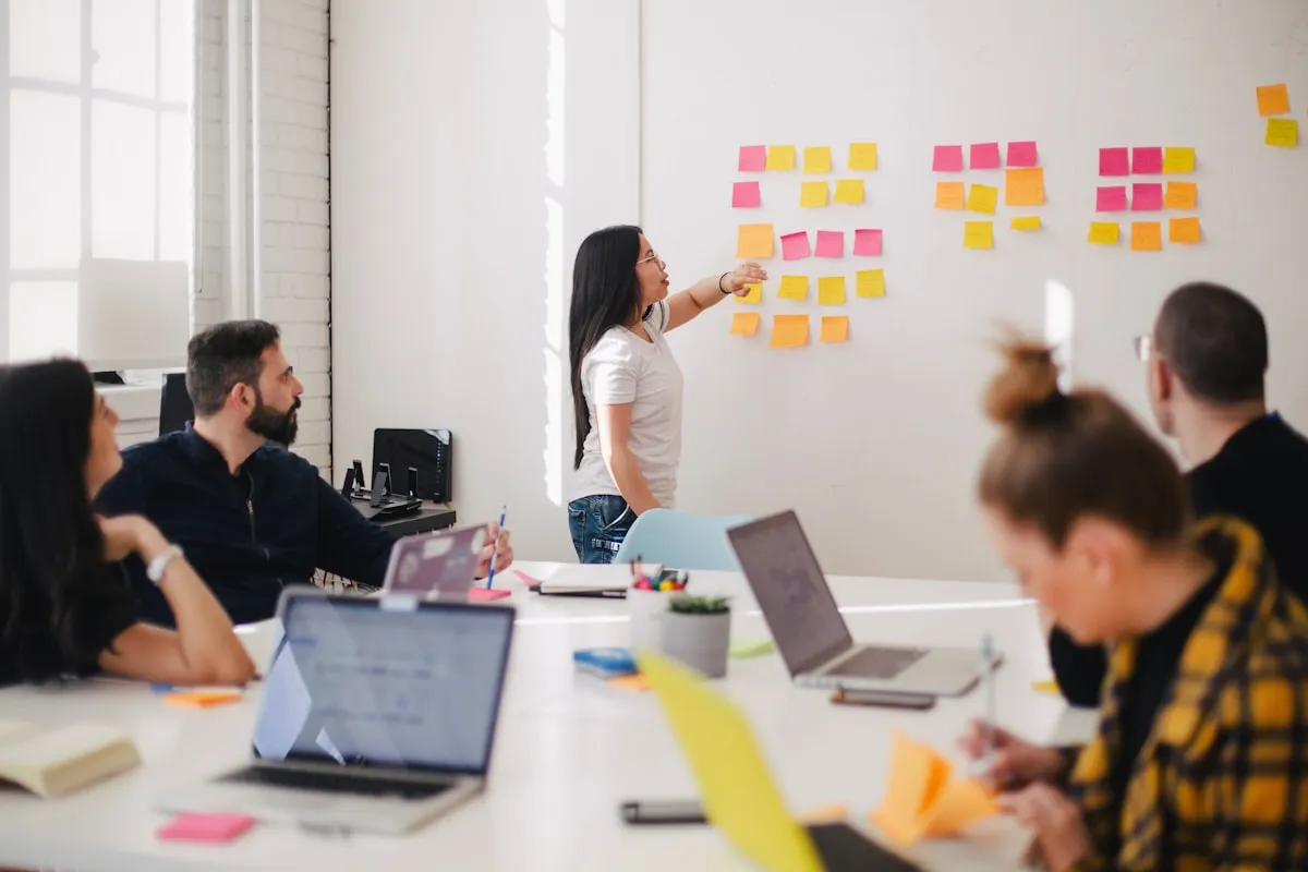 A team working through ideas on sticky notes during a strategy session