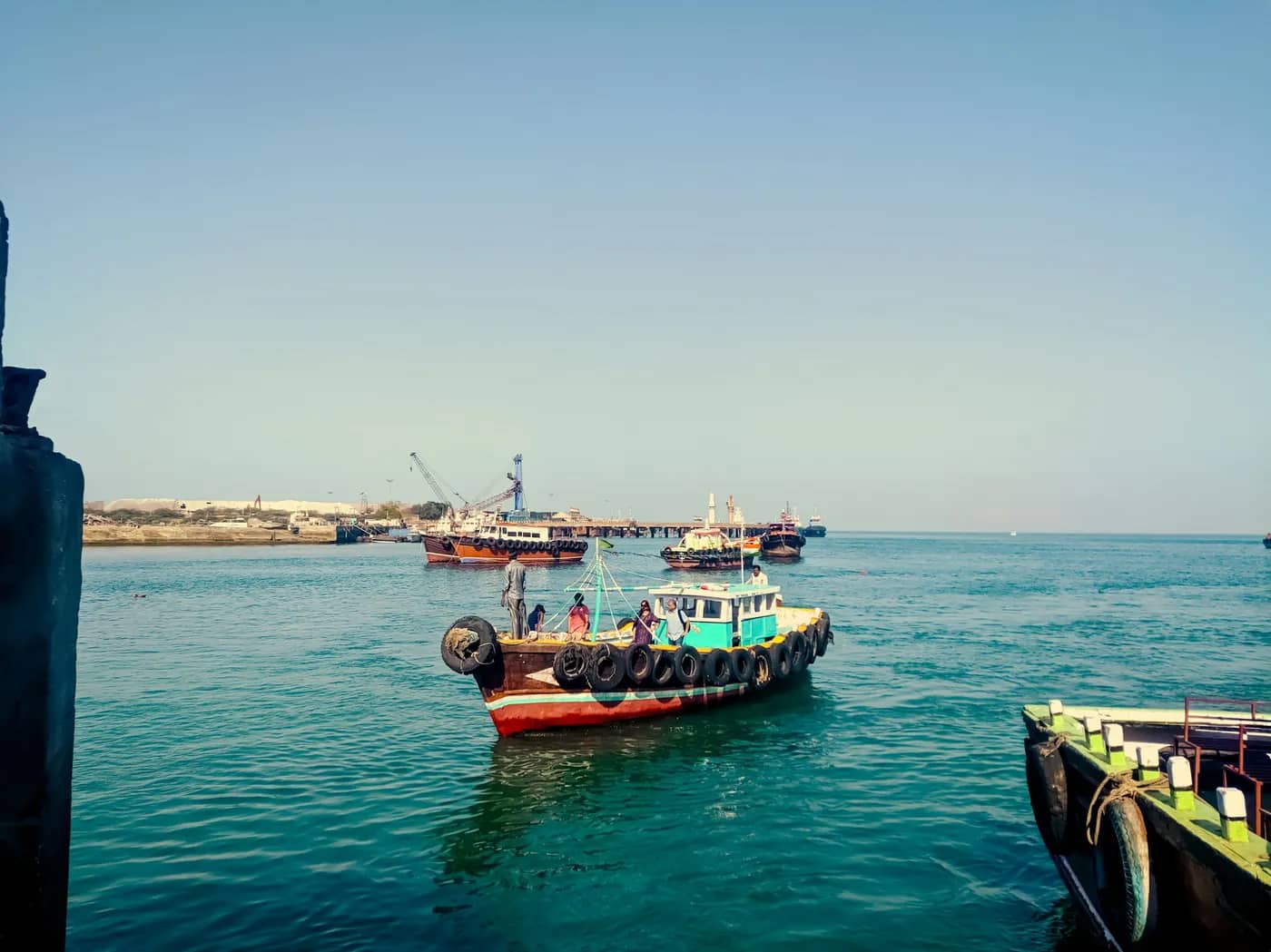 A passenger boat leaving a jetty on the Gulf of Kutch