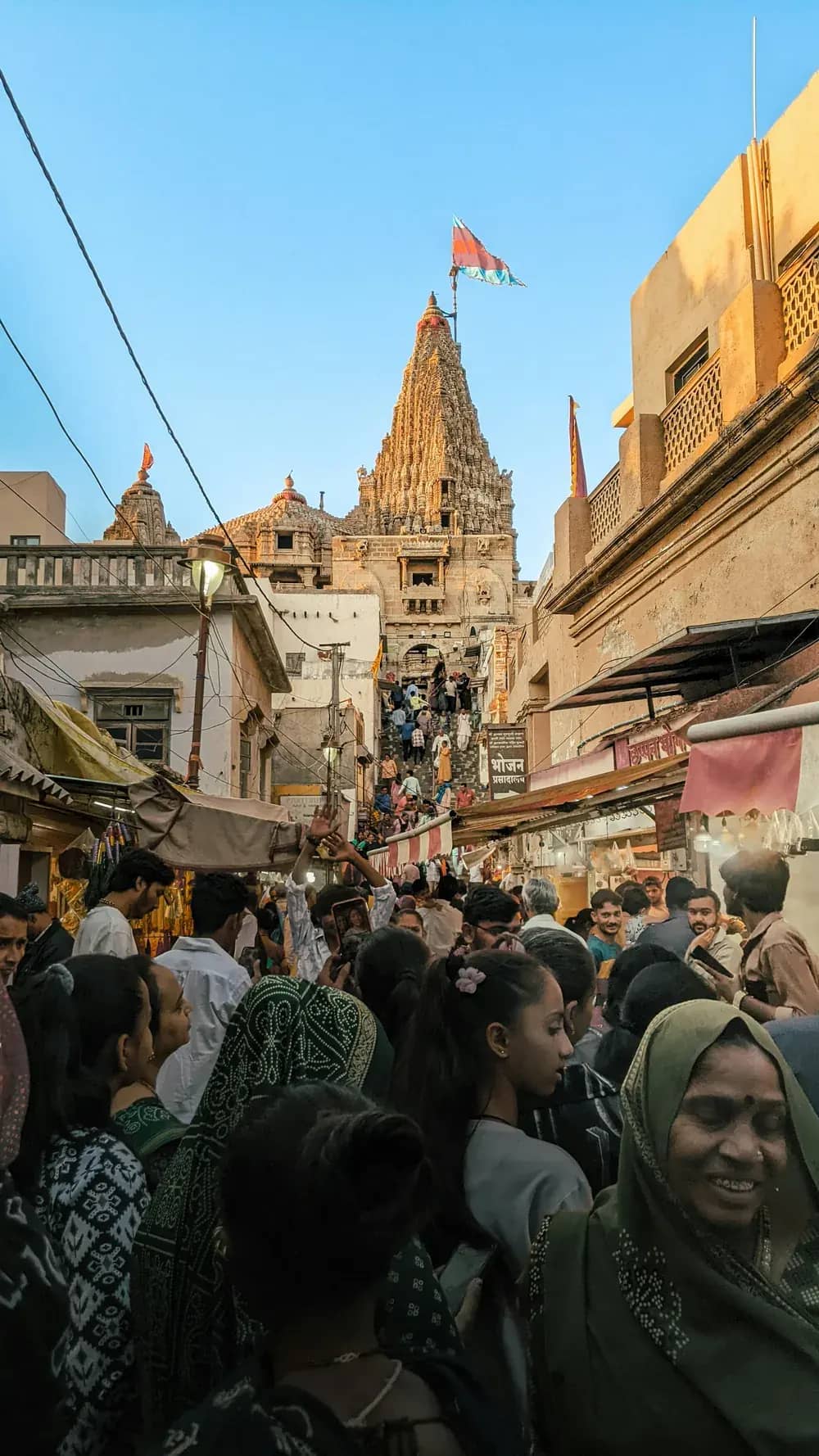 Pilgrims crowding a temple street in Dwarka