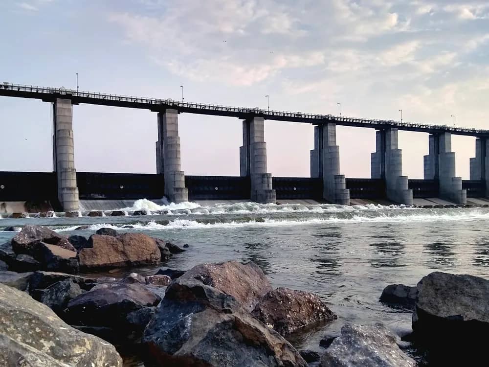 A river barrage with water flowing over rocks
