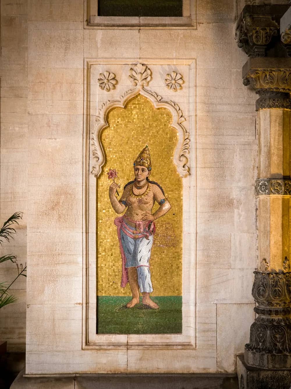 A painted panel set into a carved heritage wall in Vadodara