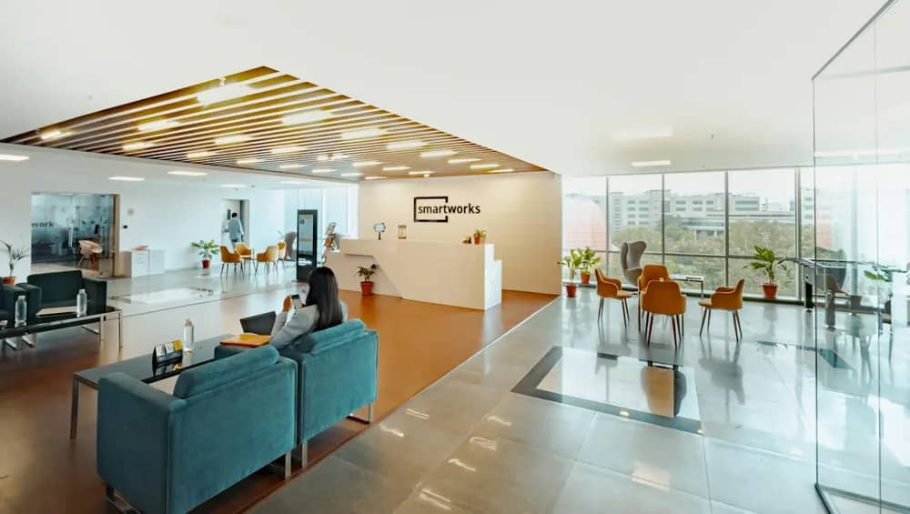 An open-plan office reception with a lounge area