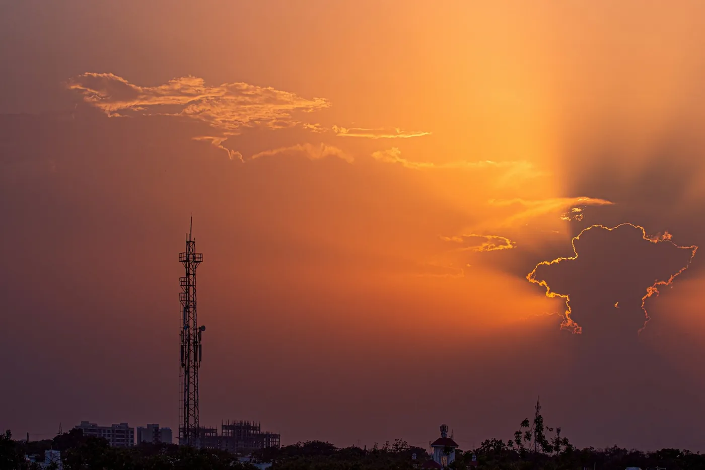 Gandhinagar skyline silhouetted at sunset